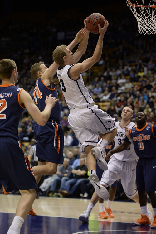 Francisco Kjolseth  |  The Salt Lake Tribune
Brigham Young Cougars guard Tyler Haws (3) drives a ball to the basket past Pepperdine in game action at the Marriott Center in Provo on Thursday, Jan. 9, 2014.