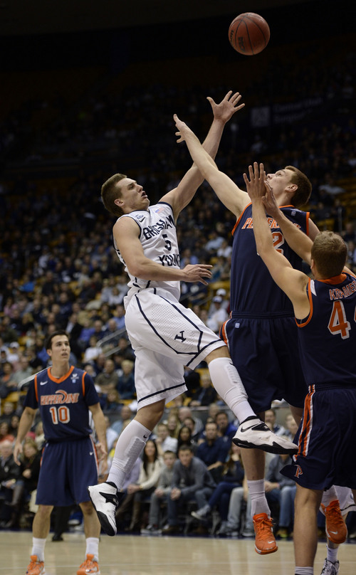 Francisco Kjolseth  |  The Salt Lake Tribune
Brigham Young Cougars guard Kyle Collinsworth (5) tries to get one past Pepperdine in game action at the Marriott Center in Provo on Thursday, Jan. 9, 2014.
