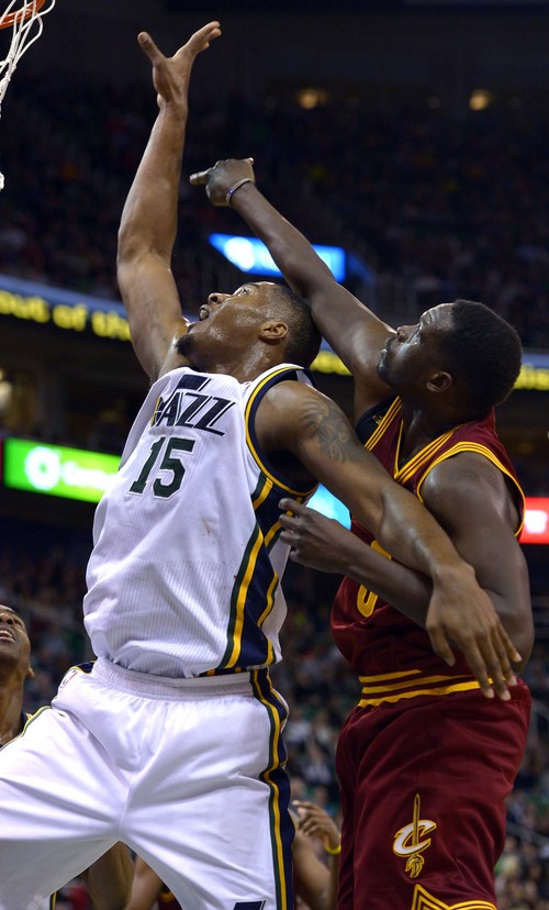 Leah Hogsten  |  The Salt Lake Tribune
Utah Jazz center Enes Kanter (0) is fouled by Cleveland Cavaliers shooting guard Matthew Dellavedova (9). The Utah Jazz are defeated by the Cleveland Cavaliers 113-102, Friday, January 10, 2014 at Energy Solutions Arena.