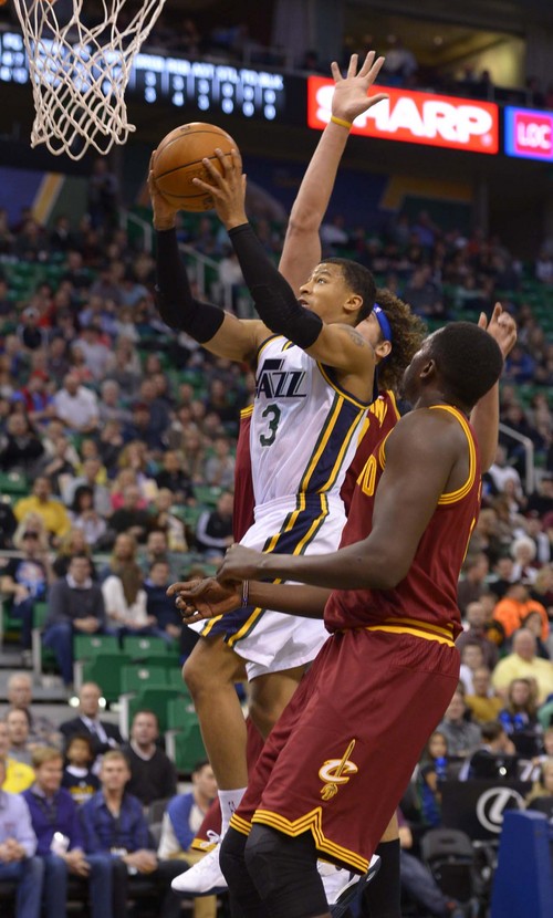 Leah Hogsten  |  The Salt Lake Tribune
Utah Jazz point guard Trey Burke (3) is fouled by Cleveland Cavaliers center Anderson Varejao (17) during their matchup, Friday, January 10, 2014 at Energy Solutions Arena.