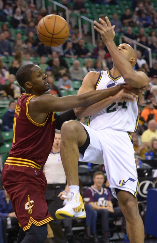 Leah Hogsten  |  The Salt Lake Tribune
Utah Jazz small forward Richard Jefferson (24) is fouled by Cleveland Cavaliers shooting guard C.J. Miles (0) during their matchup, Friday, January 10, 2014 at Energy Solutions Arena.