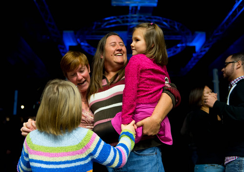 Trent Nelson  |  The Salt Lake Tribune
Hailey Bressard, Nicole Campolucci, Pat Clemons and Adison Bressard dance together at Love Elevated at the Rail Event Center Saturday January 11, 2014. Campolucci and Clemons were recently married. Love Elevated, a celebration of same-sex marriages that occurred during the 17 days between U.S. District Judge Robert Shelby's ruling striking down Utah's ban on gay marriages and the Supreme Court's stay on further marriages pending an appeal by the state, took place in Salt Lake City.