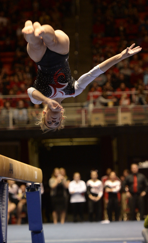 Rick Egan  | The Salt Lake Tribune 

Mary Beth Lofgren competes on the beam for the Utes, in their Gymnastics opener, Utah vs, BYU, Boise State and Southern Utah University,  at the Huntsman Center, Friday, January 10, 2014.