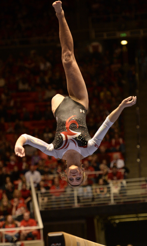 Rick Egan  | The Salt Lake Tribune 

Mary Beth Lofgren competes on the bars for the Utes, in their Gymnastics opener, Utah vs, BYU, Boise State and Southern Utah University,  at the Huntsman Center, Friday, January 10, 2014.