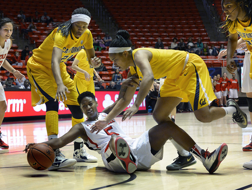 Scott Sommerdorf   |  The Salt Lake Tribune
Utah's Cheyenne Wilson grapples for control of a loose rebound during first half play. The Utah women trailed California 34-29 at the half, Sunday, January 12, 2014.
