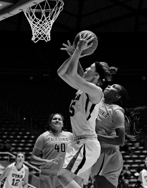 Scott Sommerdorf   |  The Salt Lake Tribune
Michelle Plouffe goes up for a shot during first half play against Cal's Reshanda Gray, right. The Utah women trailed California 34-29 at the half, Sunday, January 12, 2014.