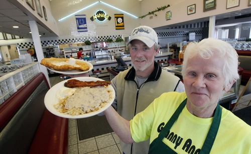 Al Hartmann  |  The Salt Lake Tribune
Annie Curry, 65, and her son Carter hold a "Kaysville Special" of eggs, bacon, hash browns smothered in special gravy and served with a fresh scone and butter at Granny Annie's, a Kaysville diner and institution. The two have opened a second Granny Annie's in Bountiful.