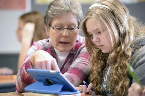Al Hartmann  |  The Salt Lake Tribune
Jill Jackson, a math teacher for 25 years, helps seventh grader Emily Newell  through a math problem on her iPad at Juab County Junior High in Nephi in December. The school has been phasing in a new interactive math curriculum.