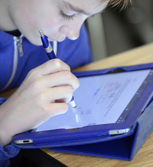 Al Hartmann  |  The Salt Lake Tribune
Seventh grader Ben Settle is able to write his answer to a math problem on his iPad with a special pen at Juab County Junior High in Nephi in December. The school has been phasing in a new interactive math curriculum.
