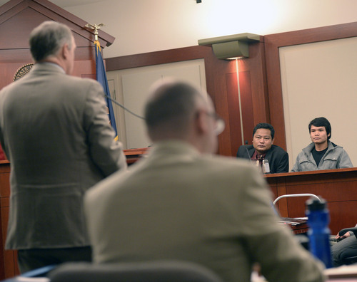 Al Hartmann  |  The Salt Lake Tribune
Maung Myo Mye, right, who shared an apartment unit with Esar Met, testifies in Judge Judith Atherton's courtroom in Salt Lake City Tuesday January 14, 2014. A court interpreter is to his left. Esar Met is accused of killing 7-year-old Hser Ner Moo, who disappeared on March 31, 2008.