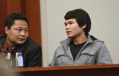 Al Hartmann  |  The Salt Lake Tribune
Maung Myo Mye, right, who shared an apartment unit with Esar Met, testifies in Judge Judith Atherton's courtroom in Salt Lake City Tuesday January 14, 2014. A court interpreter is at left. Esar Met is accused of killing 7-year-old Hser Ner Moo, who disappeared on March 31, 2008.