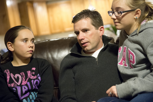 Jeremy Harmon  |  The Salt Lake Tribune

Ken Sullivan sits with his two oldest daughters, 12-year-old Kaitlyn, left, and 13-year-old Jocelyn, as he talks about the prospects of him going to Mars in 2025 during an interview at the family's home in Farmington on Sunday, January 12, 2014.