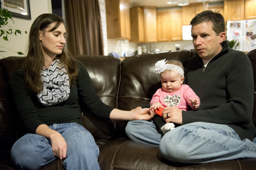 Jeremy Harmon  |  The Salt Lake Tribune

Becky Sullivan holds the hand of her 6-month-old daughter Tana as her husband, Ken, talks about the prospects of him going to Mars in 2025 while sitting with his family at their home in Farmington on Sunday, January 12, 2014.