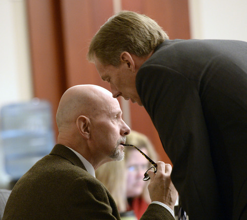Al Hartmann  |  The Salt Lake Tribune
Esar Met's defense lawyers John West, left, and Michael Peterson confer during forensic evidence testimony in Met's murder trial in Salt Lake City Wednesday January 15, 2014. Esar Met is accused of killing 7-year-old Hser Ner Moo, who disappeared on March 31, 2008.