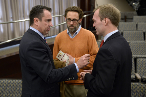 Francisco Kjolseth  |  The Salt Lake Tribune
Representative Gregory Hughes, left, speaks with Salt Lake County Mayor Ben McAdams, right, and criminal justice advisory council coordinator David Litvack following McAdams' delivery of his "State of the County" address to the county council at the Salt Lake County Government Center on Tuesday, Jan. 14, 2014.