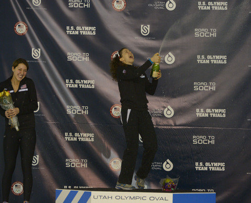 Rick Egan  | The Salt Lake Tribune 

Maria Lamb sprays champagneon the podium, as she celebrates her win in the Ladies 5000 meter U.S. Olympic time trials, at the Utah Olympic Oval Wednesday, January 1, 2014.  second place finisher, Petra Acker is on the left.