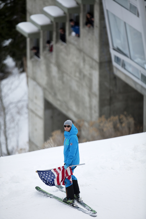 JIM MCAULEY | The Salt Lake Tribune
Olympian and men's ski coach Clint Jones delivered the American flag on skis before the US Olympic Trials for Nordic Combined ski jumping ahead of the 2014 Sochi Winter Games at the Utah Olympic Park in Park City, Utah.
