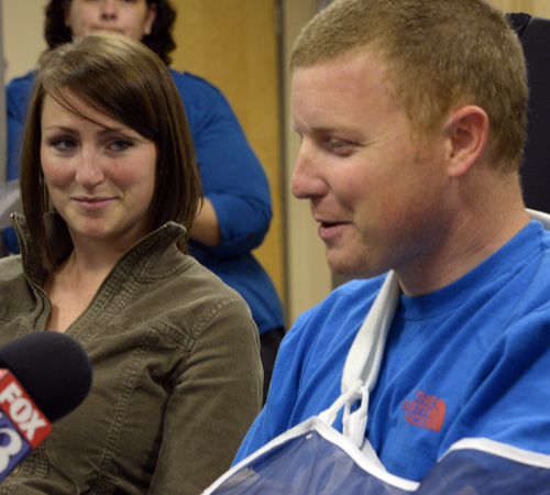Rick Egan  | The Salt Lake Tribune 

Emilee Morgan (left) listens as her husband, Matt Morgan, talks about how he survived an avalanche near the Idaho-Utah border on Saturday, during a press conference at the McKay-Dee Hospital, Wednesday, January 15, 2014.