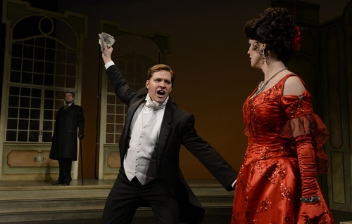 Francisco Kjolseth  |  The Salt Lake Tribune
Singers James Westman (Germont), Cody Austin (Alfredo) and Sara Gartland (Violetta), from left, perform a scene from Utah Opera's "La Traviata," Verdi's hit show about the courtesan with a heart of gold, her impetuous boyfriend and his meddling dad.