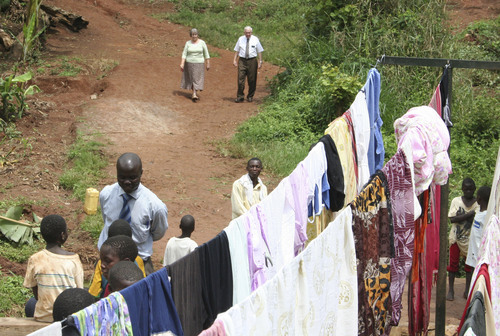Jeremiah Stettler | The Salt Lake Tribune
Lincoln and Marilyn Barlow descend a steep hillside in southern
Uganda to a community wash basin, where dozens of women and children are scrubbing their clothes and stringing them up on lines. The LDS Church paid for the project as part of a humanitarian effort to bring cleaner water and better sanitation to the African nation.