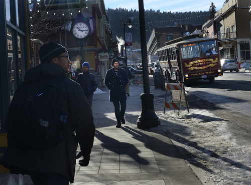 Scott Sommerdorf   |  The Salt Lake Tribune
Bundled up visitors to Park City walk along Main Street, Thursday, January 16, 2014.