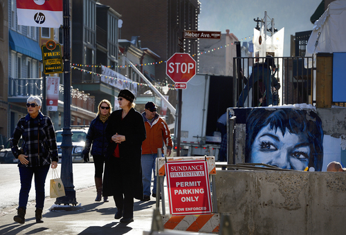 Scott Sommerdorf   |  The Salt Lake Tribune
People walk down Main Street in Park City, Wednesday, January 15, 2014.