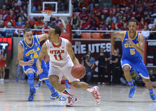 Scott Sommerdorf   |  The Salt Lake Tribune
Utah had lots of trouble with the Bruins full court press. Here, Brandon Taylor works his way through the trap after an in-bounds pass during second half play, Saturday, January 18, 2014. Utah beat UCLA 74-69.