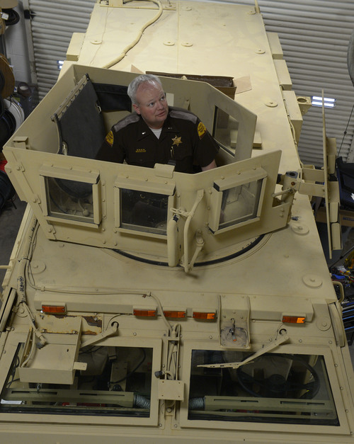 Rick Egan  | The Salt Lake Tribune 

Lt. Alex Lepley stands inside a mine-resistant vehicle (MRAP)  is being fixed up for duty at the UHP maintenance shop in Taylorsville, Monday, January 13, 2014.