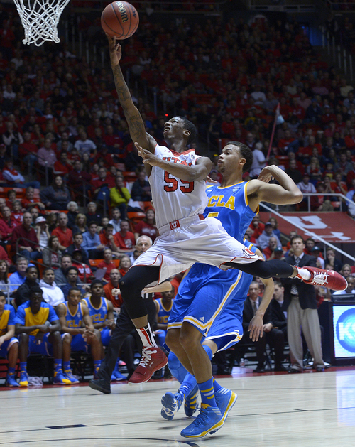 Scott Sommerdorf   |  The Salt Lake Tribune
Utah's Delon Wright goes up for a layup during first half play against UCLA and  the defense of Kyle Anderson, Saturday, January 18, 2014. Utah held a 36-26 lead over UCLA at the half.