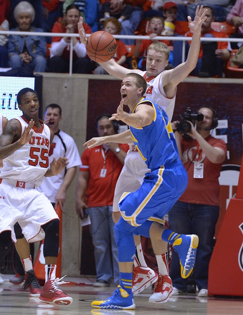 Scott Sommerdorf   |  The Salt Lake Tribune
UCLA's Travis Wear reacts to losing the ball as Utah's Dallin Bachynski and Delon Wright, left, defend during first half play, Saturday, January 18, 2014. Utah held a 36-26 lead over UCLA at the half.