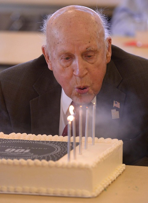 Leah Hogsten  |  The Salt Lake Tribune
John Whitby blows out the candles on his birthday cake. Veteran John Whitby celebrated his 100th birthday, January 16th, with a party in his honor January 18, 2014 at the William E. Christoffersen Salt Lake Veterans Home, with other veterans, family, friends and loved ones in attendance.
