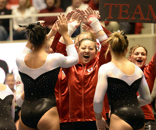 Rick Egan  | The Salt Lake Tribune 

The Lady Utes greet Kailah Delany, after her vault for the Utes, in their Gymnastics opener, Utah vs, BYU, Boise State and Southern Utah University,  at the Huntsman Center, Friday, January 10, 2014.