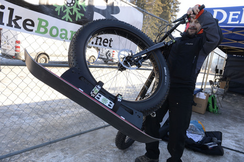 Francisco Kjolseth  |  The Salt Lake Tribune
David Bach shows off his BikeBoards creation that allows the addition of a ski to a bike tire for snow gluiding. Companies opened the annual Outdoor Retailer Winter Market Show by allowing folks to try their gear at demo day at Solitude Mountain Resort in Big Cottonwood Canyon on Tuesday, Jan. 21, 2014.
