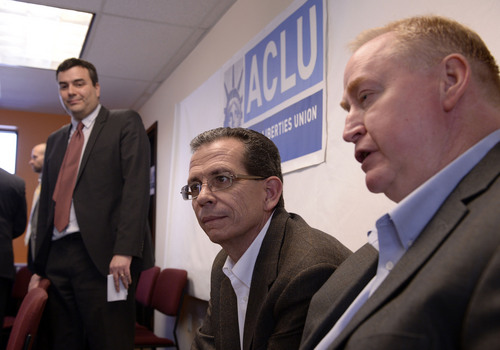 Al Hartmann  |  The Salt Lake Tribune
Plaintiffs Carl Fritz Shultz and, center, and Donald Johnston, who are legally married, attend the announcement of ACLU of Utah's filing of a lawsuit Tuesday Jan. 21, 2014, in Salt Lake City over Utah's refusal to recognize valid same-sex marriages that occurred before the U.S. Supreme Court issued a stay. John Mejia, legal director, ACLU of Utah, left.