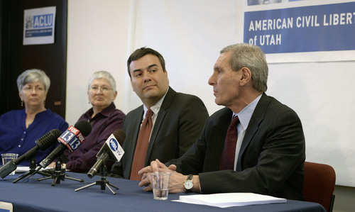 Al Hartmann  |  The Salt Lake Tribune
John Mejia, legal director, ACLU of Utah, center, and Erik Strindberg, lawyer for plaintiffs, right, announce filing of a lawsuit Tuesday Jan. 21, 2014, in Salt Lake City over Utah's refusal to recognize valid same-sex marriages that occurred before the U.S. Supreme Court issued a stay.