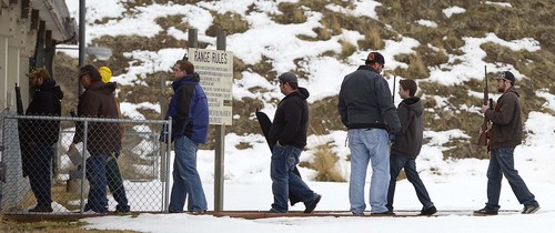 Leah Hogsten  |  The Salt Lake Tribune
Rifle carriers file into the range at the Lee Kay Center Range in West Valley City, Saturday, January 11, 2014.The National Shooting Sports Foundation is releasing a report on the economic value of target shooting in Utah and the United States.