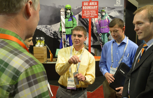 Rick Egan  | The Salt Lake Tribune 

Jeff Larsen, Salomon (left) listens as Tanner Harrison talks about the Wolf em Stick, made by he and his brother, Spencer Harrison, as they tour the Outdoor Retailers Convention, along with Salt Lake County Mayor Ben McAdams, at the Salt Palace, Thursday, January 23, 2014.