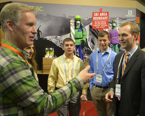 Rick Egan  | The Salt Lake Tribune 

Jeff Larsen, Salomon (left) talks about the  Wolf em Stick, made by Tanner and Spencer Harrison, as they tour the Outdoor Retailers Convention, along with Salt Lake County Mayor Ben McAdams, at the Salt Palace, Thursday, January 23, 2014.