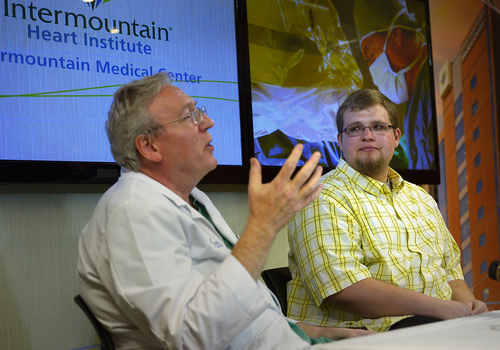 Scott Sommerdorf   |  The Salt Lake Tribune
Cardiologist Jeff Osborn, M.D. speaks about the defibrillator device he implanted in patient Brandon England, 20, right, at Intermountain Medical Center Heart Institute. The institute made heart history with the implantation of Utah's first subcutaneous cardiac defibrillator to prevent sudden death from cardiac arrest, Thursday, January 23, 2014.