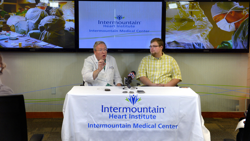 Scott Sommerdorf   |  The Salt Lake Tribune
Cardiologist Jeff Osborn, M.D., left, and patient Brandon England, 20, speak as photos of his procedure are displayed behind them at Intermountain Medical Center Heart Institute. The institute made heart history with the implantation of Utah's first subcutaneous cardiac defibrillator to prevent sudden death from cardiac arrest, Thursday, January 23, 2014.