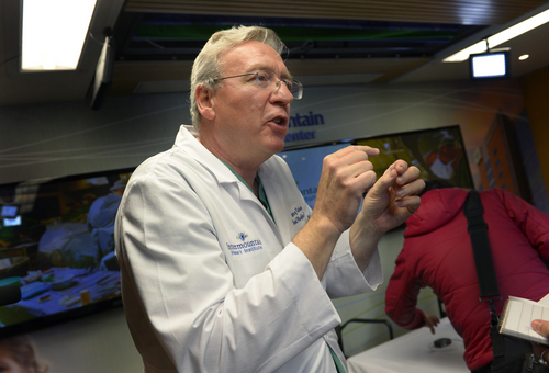 Scott Sommerdorf   |  The Salt Lake Tribune
Cardiologist Jeff Osborn, M.D. speaks about the procedure to implant the subcutaneous defibrillator device in patient Brandon England at Intermountain Medical Center Heart Institute. The institute made heart history with the implantation of Utah's first subcutaneous cardiac defibrillator to prevent sudden death from cardiac arrest, Thursday, January 23, 2014.