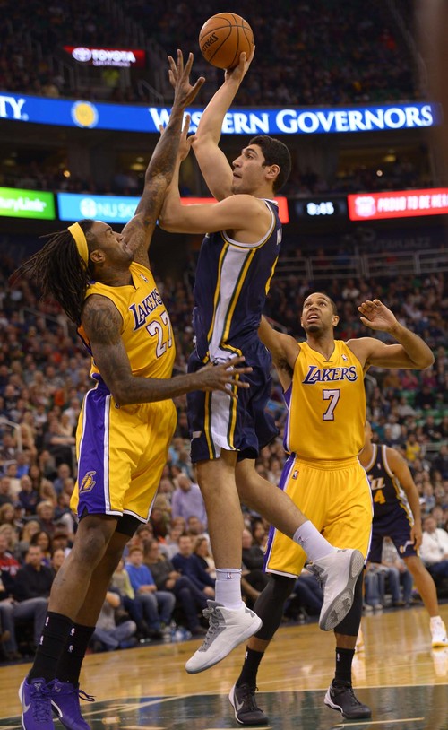 Leah Hogsten  |  The Salt Lake Tribune
Utah Jazz center Enes Kanter (0) drives to the net over Los Angeles Lakers center Jordan Hill (27). The Utah Jazz defeated the LA Lakers 105-103, Friday, December 27, 2013 at Energy Solutions Arena in Salt Lake City.