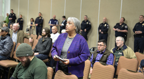 Keith Johnson | The Salt Lake Tribune

Juanita Ramos Corum asks a question of West Valley City police chief Lee Russo during an open meeting with the community at the Utah Cultural Celebration Center, January 23, 2014. Russo discussed crime prevention, accountability within the department and future plans for the organization. Russo plans to hold the meetings monthly.