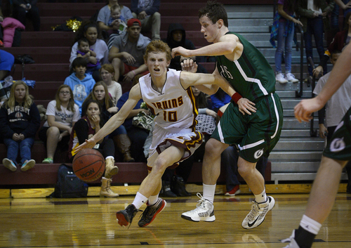 Scott Sommerdorf   |  The Salt Lake Tribune
Mountain View's Ryan Warner tries to drive the baseline against Conner Haller of Olympus during first half play. Olympus defeated Mountain View 73-64 in Orem, Friday, January 24, 2014.