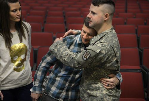 Scott Sommerdorf   |  The Salt Lake Tribune
Spc. Jose "Joe" Artalejo, gets a hug from Sgt. Jake Vallen after the presentation of the Purple Heart. Vallen and Artalejo were deployed together in Afghanistan. Artalejo, of the 118th Engineer (Sapper) Company, Utah Army National Guard, received the Purple Heart in a ceremony Saturday, Jan. 25, 2014, at Camp Williams. Artalejo, of Pleasant Grove, qualified for the Purple Heart due to wounds he received during an improvised-explosive-device incident on Dec. 24, 2010, in Khowst Province, Afghanistan.
