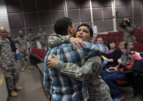 Scott Sommerdorf   |  The Salt Lake Tribune
Spc. Jose "Joe" Artalejo, gets a hg from his sister, Somaya Andreason after he was awarded the Purple Heart Saturday, Jan. 25, 2014, at Camp Williams. Artalejo, now a civilian. but formerly of the 118th Engineer (Sapper) Company, Utah Army National Guard, received the Purple Heart due to wounds he received during an improvised-explosive-device incident on Dec. 24, 2010, in Khowst Province, Afghanistan.