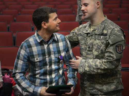 Scott Sommerdorf   |  The Salt Lake Tribune
Spc. Jose "Joe" Artalejo, speaks with Sgt. Jake Vallen after the presentation of the Purple Heart. Vallen and Artalejo were deployed together in Afghanistan. Artalejo, of the 118th Engineer (Sapper) Company, Utah Army National Guard, received the Purple Heart in a ceremony Saturday, Jan. 25, 2014, at Camp Williams. Artalejo, of Pleasant Grove, qualified for the Purple Heart due to wounds he received during an improvised-explosive-device incident on Dec. 24, 2010, in Khowst Province, Afghanistan.