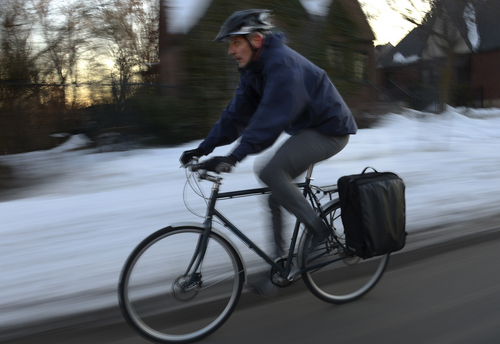 Scott Sommerdorf   |  The Salt Lake Tribune
Jason Hamula, a family practice doctor rides his bike home from work during an orange alert bad air day, Friday, January 24, 2014.