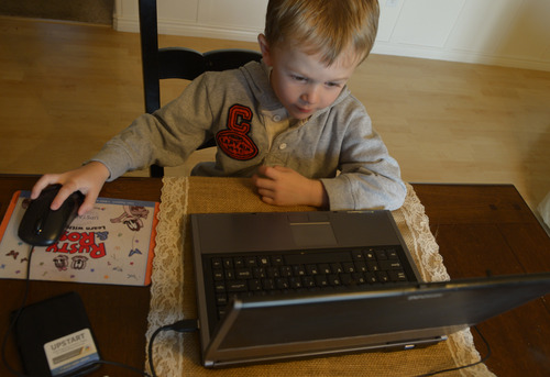 Rick Egan  | The Salt Lake Tribune 

Five-year-old Ashton VanLeeuwen  works on the UPSTART preschool software program at his home in West Jordan, Wednesday, January 22, 2014.