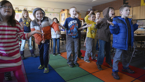 Al Hartmann  |  The Salt Lake Tribune
Second-graders in Angie Leone's classroom at Hawthorne Elementary bounce and jiggle to a music video during a quick morning break from study. These short bursts of guided exercise and dance, "brain breaks," combat obesity and boost academic performance. It's also a go-to strategy on bad air days when pollution-trapping winter inversions make it unhealthy for children to go outside for recess.